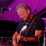 Kev Walford - Singer, songwriter and guitarist on stage at Folk East.